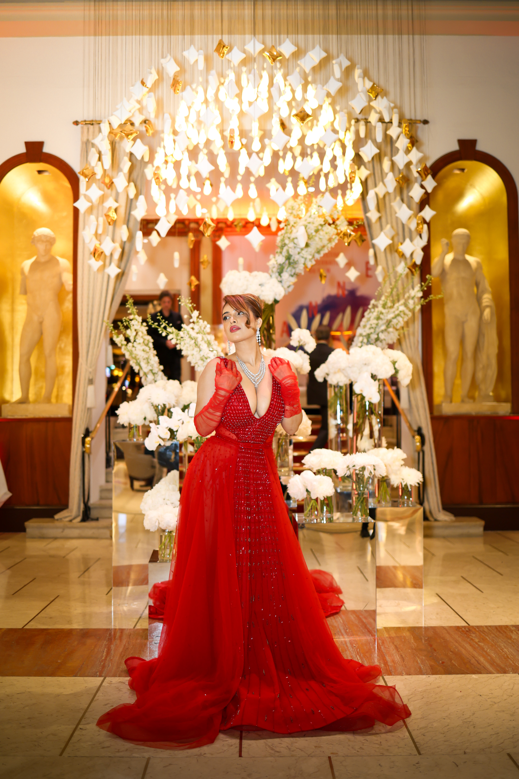 Red couture gown at a Cannes 2026 evening event